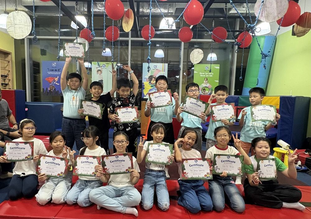 Children holding their certificates at the JumpStart Milestone Celebration